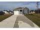 Newly constructed home with gray siding, attached garage, and a paved driveway at 314 Acosta Circle, Conway, SC 29527