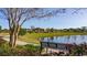 Scenic pond with walking path and bench in a residential area at 533 Black Pearl Way, Myrtle Beach, SC 29588