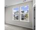 Bright bedroom with neutral walls, carpet, and street view at 1958 Woodrush Loop, Little River, SC 29566