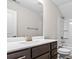 Bathroom with dark brown vanity and white countertop at 1958 Woodrush Loop, Little River, SC 29566