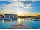 Community pool with a bathhouse at sunset at 1958 Woodrush Loop, Little River, SC 29566