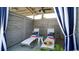 Relaxing cabana with lounge chairs near the pool at 1958 Woodrush Loop, Little River, SC 29566