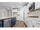 Modern kitchen, featuring double ovens, gas cooktop, and herringbone backsplash at 1958 Woodrush Loop, Little River, SC 29566