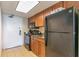 Small kitchen featuring granite countertops and black appliances at 1105 S Ocean Blvd. # 1040, Myrtle Beach, SC 29577
