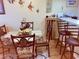Bright dining area with glass-top table and four chairs,wine rack, and beach decor at 351 Lake Arrowhead Rd. # 20-179, Myrtle Beach, SC 29572