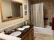 Double vanity bathroom with granite countertops and tiled shower at 351 Lake Arrowhead Rd. # 20-179, Myrtle Beach, SC 29572