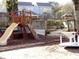 playground with a playset, slide, and spinner at 351 Lake Arrowhead Rd. # 20-179, Myrtle Beach, SC 29572