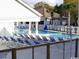 Community pool with plenty of lounge chairs at 351 Lake Arrowhead Rd. # 20-179, Myrtle Beach, SC 29572
