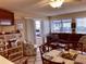 Comfortable living room featuring a sofa, arm chair, and access to a balcony at 351 Lake Arrowhead Rd. # 20-179, Myrtle Beach, SC 29572