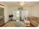 Spacious living room with hardwood floors and sliding glass doors to patio at 4917 Twin Pond Ct. # 102, Myrtle Beach, SC 29579