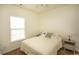 Bedroom with double bed, nightstands, and window at 4917 Twin Pond Ct. # 102, Myrtle Beach, SC 29579