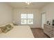 King-size bed in a well-lit bedroom with backyard access at 4917 Twin Pond Ct. # 102, Myrtle Beach, SC 29579
