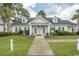 Community clubhouse with ample parking and landscaping at 4917 Twin Pond Ct. # 102, Myrtle Beach, SC 29579