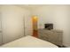 Bedroom with dresser, TV, and access to bathroom at 4917 Twin Pond Ct. # 102, Myrtle Beach, SC 29579