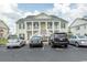 Three-story building exterior with parking in front at 4917 Twin Pond Ct. # 102, Myrtle Beach, SC 29579