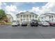 Building with parking spaces in front and other buildings in the background at 4917 Twin Pond Ct. # 102, Myrtle Beach, SC 29579