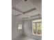 Bright bedroom with tray ceiling, large window, and lots of natural light at 410 40Th Ave. N, Myrtle Beach, SC 29577