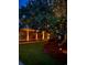 Evening view of charming house exterior with landscape lighting at 410 40Th Ave. N, Myrtle Beach, SC 29577