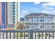 Balcony view of ocean and other buildings at 3401 N Ocean Blvd. # 306, North Myrtle Beach, SC 29582