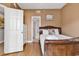 Bedroom with a full-size bed, dresser, and access to a bathroom at 3401 N Ocean Blvd. # 306, North Myrtle Beach, SC 29582