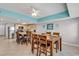 Open concept kitchen with island, tile floor, and ceiling fan at 3401 N Ocean Blvd. # 306, North Myrtle Beach, SC 29582
