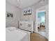 Bedroom with a dresser and view into another room at 3401 N Ocean Blvd. # 306, North Myrtle Beach, SC 29582