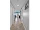 Bright hallway with tile floors and doors at 3401 N Ocean Blvd. # 306, North Myrtle Beach, SC 29582