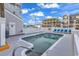 Refreshing community pool with lounge chairs and building views at 3401 N Ocean Blvd. # 306, North Myrtle Beach, SC 29582