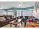 Relaxing living room featuring two sofas, a coffee table, and access to a balcony at 3401 N Ocean Blvd. # 306, North Myrtle Beach, SC 29582