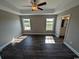 Spacious bedroom with two windows, ceiling fan, and dark flooring at Tbd22 Privetts Rd., Conway, SC 29526