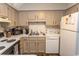 Clean and efficient kitchen featuring white appliances and cabinets at 1206 Benna Dr. # 4-F, Myrtle Beach, SC 29577