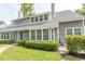Gray two-story house with a well-maintained lawn and shrubs at 1206 Benna Dr. # 4-F, Myrtle Beach, SC 29577