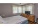 Guest bedroom with dresser and window coverings at 1206 Benna Dr. # 4-F, Myrtle Beach, SC 29577