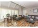 Living room with vaulted ceiling, hardwood floors, and a dining area at 1206 Benna Dr. # 4-F, Myrtle Beach, SC 29577