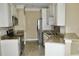Modern kitchen with granite countertops and stainless steel appliances at 144 Puffin Dr. # 2-E, Pawleys Island, SC 29585