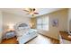 Bright bedroom with a queen-size bed and wood floors at 144 Puffin Dr. # 2-E, Pawleys Island, SC 29585
