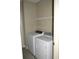 Convenient laundry area with washer, dryer, and overhead shelving at 144 Puffin Dr. # 2-E, Pawleys Island, SC 29585