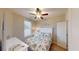 Cozy bedroom featuring a comfortable bed and plenty of natural light at 144 Puffin Dr. # 2-E, Pawleys Island, SC 29585