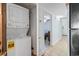 Compact laundry closet with stacked washer and dryer at 1321 S Ocean Blvd. # 606, North Myrtle Beach, SC 29582