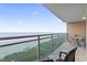 Oceanfront balcony with table and chairs, offering stunning beach views at 1321 S Ocean Blvd. # 606, North Myrtle Beach, SC 29582