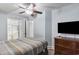Bedroom with double bed, dresser, TV, and bathroom access at 1321 S Ocean Blvd. # 606, North Myrtle Beach, SC 29582