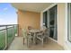 Balcony with table and chairs perfect for outdoor dining at 1321 S Ocean Blvd. # 606, North Myrtle Beach, SC 29582