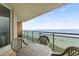 Ocean view balcony with small table and chairs at 1321 S Ocean Blvd. # 606, North Myrtle Beach, SC 29582