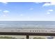 Expansive ocean and beach view from a balcony at 1321 S Ocean Blvd. # 606, North Myrtle Beach, SC 29582