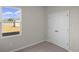 Bright bedroom with double door closet and view of backyard at 3058 Deerberry Place, Longs, SC 29568