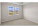 Spacious bedroom with two windows and neutral decor at 3058 Deerberry Place, Longs, SC 29568