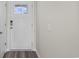 Front entry with white door, keyless entry, and wood-look flooring at 3058 Deerberry Place, Longs, SC 29568