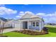 Newly built home with light blue siding, white accents, and a neatly landscaped yard at 3058 Deerberry Place, Longs, SC 29568