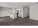 Open concept kitchen with island and hardwood floors at 3058 Deerberry Place, Longs, SC 29568