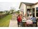 Friends enjoying food and drinks on a patio at 1617 Littleleaf Loop, North Myrtle Beach, SC 29582